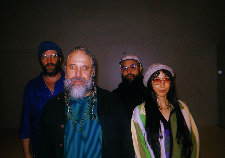 Members of Natural Information Society stand against a wall.