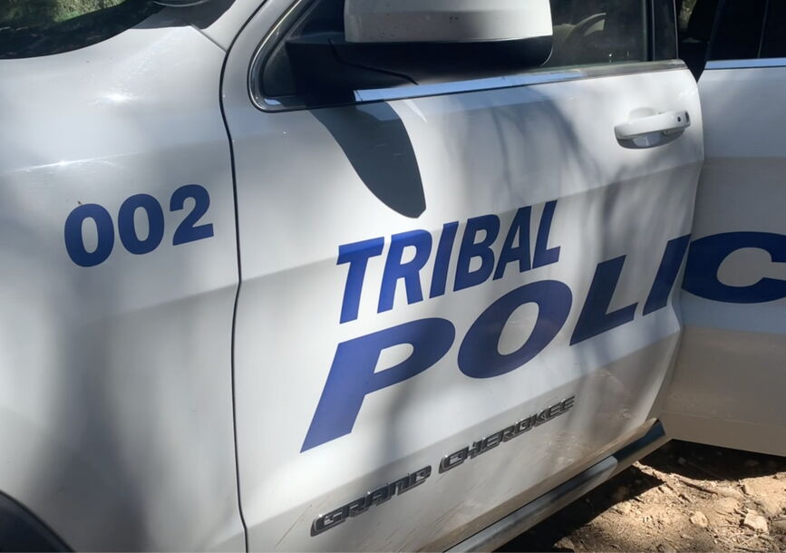 A police car with a door open.